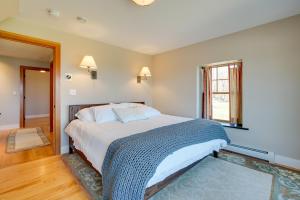 a bedroom with a large bed and a window at Peaceful Marlboro Vacation Rental with Sauna and Yard! in Marlboro
