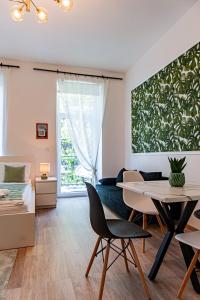 a living room with a table and a bed at My city apartment- Vienna jungle room in Vienna