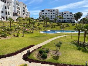 a park with a swimming pool and buildings at CABO NEGRO - LILAC'S GARDEN - PISCINE - JARDIN - PARKING in Martil