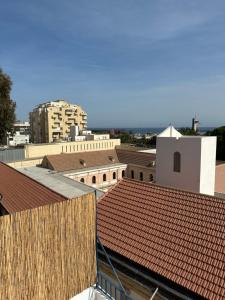 a view of roofs of buildings in a city at La casa de papel in Almería