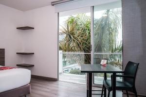 Una cama o camas en una habitación de Hotel Portal Del Norte