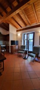 a living room with two chairs and a table at La Casetta di Sornico in Lierna