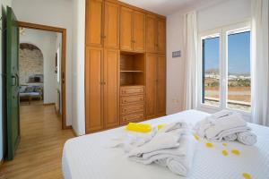 A bed or beds in a room at SAIL VILLA