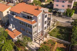 an overhead view of a large house with an orange roof at Apartment Flora in Pula