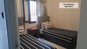 Postel nebo postele na pokoji v ubytování Martil Center Apartments