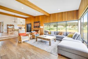 a living room with a couch and a table at Aloha House in Sea Ranch