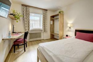 Tempat tidur dalam kamar di Hotel Schlair