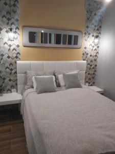 Postel nebo postele na pokoji v ubytování Apartman Golden