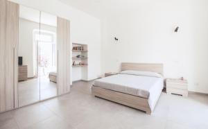 Postel nebo postele na pokoji v ubytování Appartamento ai Portici Sampietro