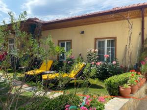 a yellow bench in the yard of a house at Three Palms Suites in Akyaka