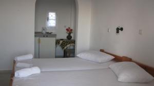 Posteľ alebo postele v izbe v ubytovaní Aronis Plaka Naxos