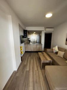 a living room with a couch and a table at VERANO AZUL in Benidorm
