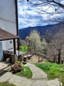 a porch of a house with a view of the mountains at Albergo Ristorante La Selva in Orsigna