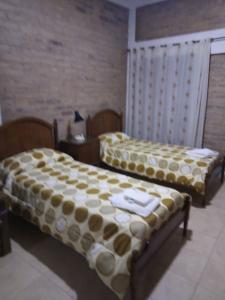 Katil atau katil-katil dalam bilik di Vicchi