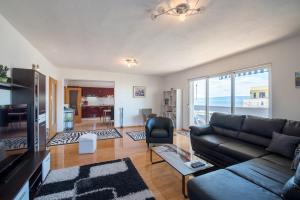 a living room with a couch and a television at Apartment Gorana in Split