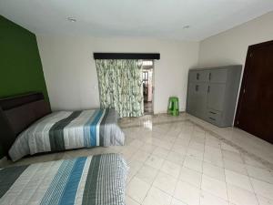 Postel nebo postele na pokoji v ubytování Agradable Habitación Ojo de agua