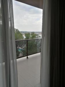a view of a balcony from a room with a window at Aparthotel El Faro in Cullera
