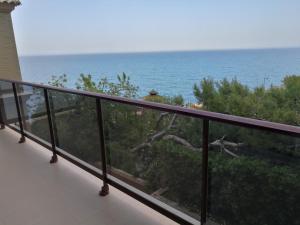 a balcony with a view of the ocean at Aparthotel El Faro in Cullera