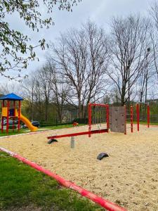 a playground with a slide at Wanderurlaub mit und ohne Hund! in Harra +12 photos