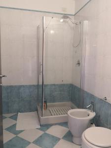 a bathroom with a shower and a toilet at You Welcome Apt in Elmas