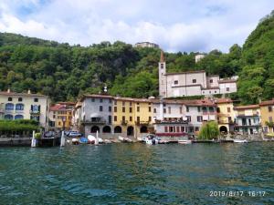 a group of buildings next to a body of water at Casa Orchidea in Oria