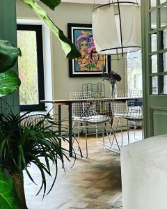 a dining room with a table and chairs at Villa Grimm in Sainte-Marie-aux-Mines