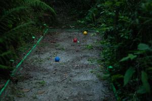 three balls on a dirt path in the woods at Mulino di Castelvecchio in Borgo a Buggiano
