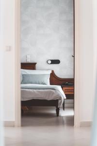 Postel nebo postele na pokoji v ubytování Zeus Village Resort - Adults Only