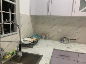 a kitchen with a sink and a counter top at Bahria Residency 1 in Islamabad