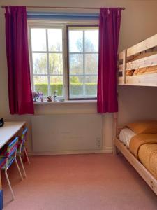 Ένα ή περισσότερα κρεβάτια σε δωμάτιο στο Åsnen National Park - Holiday Home