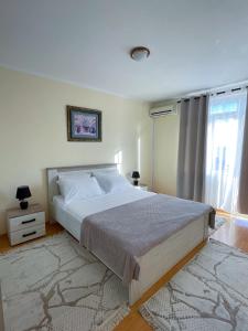 Postel nebo postele na pokoji v ubytování Apartman 200