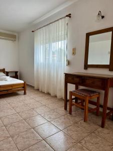 A bed or beds in a room at Sfinias Apartments