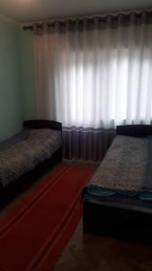 Postel nebo postele na pokoji v ubytování Эдем ИссыкКуль
