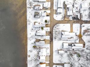 an aerial view of a yard covered in snow at Mader Haven Across from the Lake home in Shawano