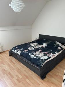 a bedroom with a bed in a room with a floor at Gamlitz - RaStra Top 20 in Gamlitz