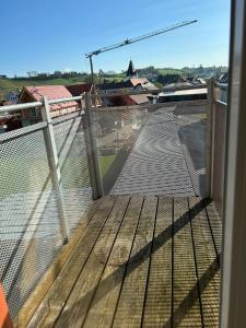 a balcony with a fence and a view of a building at Gamlitz - RaStra Top 20 in Gamlitz