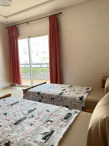 Letto o letti in una camera di Nice Apartment in Marina Agadir