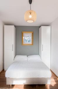 Łóżko lub łóżka w pokoju w obiekcie Apartament rodzinny