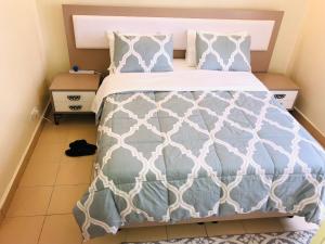 Postel nebo postele na pokoji v ubytování Maliaways Comfy Airbnb-Jkia