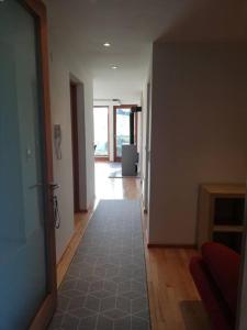 an empty room with a hallway with a door and a hallway at Urlaub in Alberschwende in Alberschwende