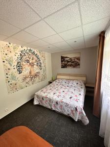 A bed or beds in a room at Penzión Michaela Vyhne