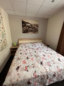 A bed or beds in a room at Penzión Michaela Vyhne