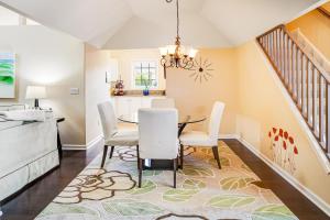 a dining room with a table and chairs at Plantations East - 221 Lakeside Dr in Lewes