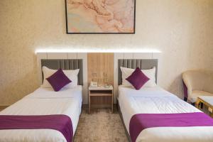 Postel nebo postele na pokoji v ubytování Diamond Corners Hotel + 28 fotografií
