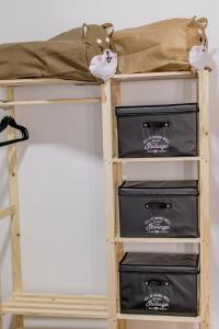 a bunk bed with three boxes on top at Wabisabi Residence in Araxá