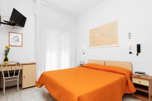 A bed or beds in a room at Albergo Eva