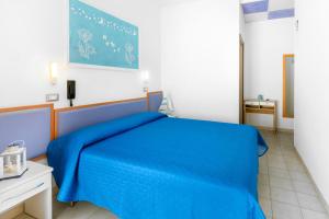 A bed or beds in a room at Albergo Eva