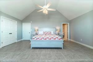 En eller flere senge i et værelse på Beachy Keen