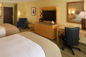 a hotel room with two beds and a television at Holiday Inn Express Mill Valley - Sausalito Area, an IHG Hotel in Mill Valley