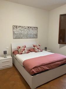 Säng eller sängar i ett rum på Albachiara